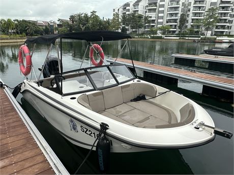 Nearly new bowrider power boat with Mercury outboard